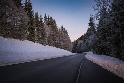 Free Download Hd Wallpaper Highway Between Snow Covered Pine Trees