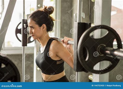 Young Asian Fitness Woman In Sportswear Exercising Building Muscles
