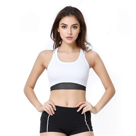 Premium Ai Image A Woman In A White And Black Sports Bra Is Posing With Her Hands On Her Hips