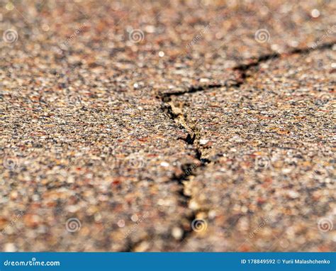 Closeup Of A Longitudinal Crack In The Asphalt Pavement Of A Highway
