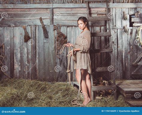 Young Girl In A Barn With A Rope In Her Hands Stock Image Image Of