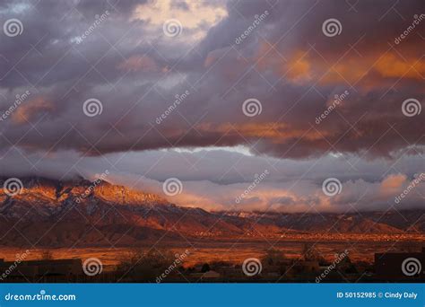 A New Mexico Sunset With Mountains And Clouds Stock Image Image Of