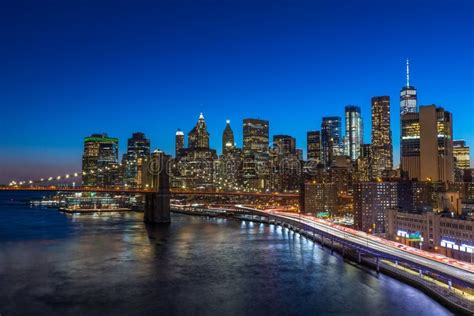 Brooklyn Bridge In Manhattan Downtown With Cityscape At Night New York