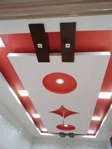 The Ceiling Is Painted With Red And White Paint While The Lights Are