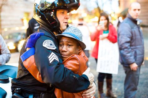 Photo Police Officer And Young Demonstrator Share Hug During Ferguson