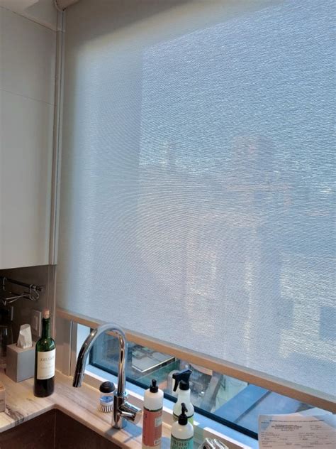 Create a fresh and inviting living room by choosing white teamed with delicate florals. Light Filtering Window Shades | SoHo-Nolita Residence, NYC