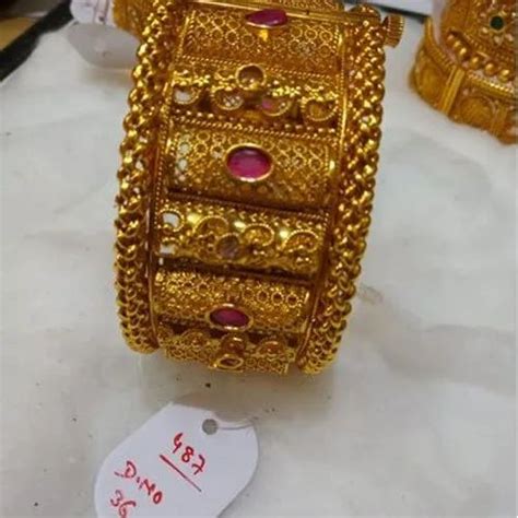 brass base artificial party wear single broad gold plated kada at rs