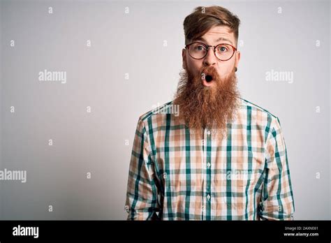 Handsome Irish Redhead Man With Beard Wearing Glasses And Hipster Shirt