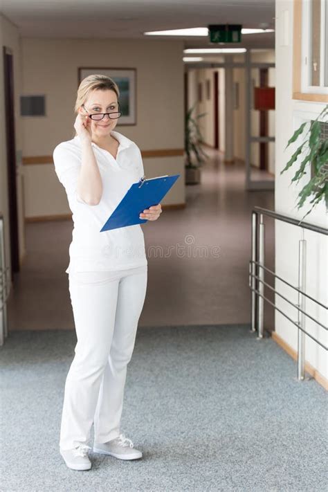 Female Nurse Or Doctor In The Corridor Of An Hospital Or Retirement