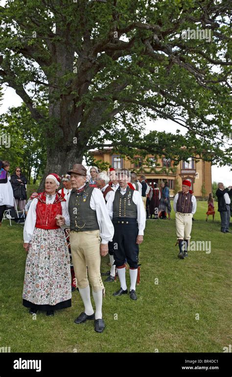 people in traditional swedish folk costumes at midsummer celebration naas castle estate sweden