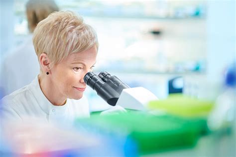 Female Bioscientist With Microscope Stock Photo Download Image Now