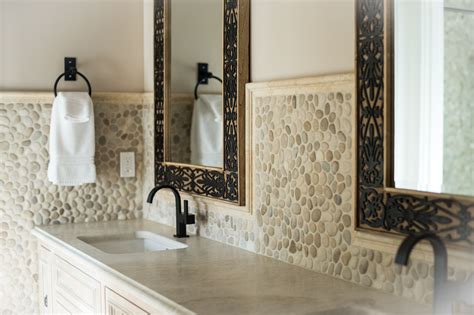 Why they put some other tile in the shower niche is beyond me. Java Tan Pebble Tile | Cheap bathroom remodel, Stone backsplash, Backsplash