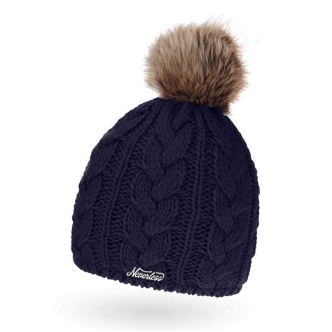 The Cable Knit Beanie With A Pom Pom On Top Is Shown