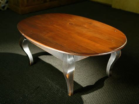 Not only does this upcycled coffee table have a vintage flair that will stand the test of time but it also provides functional storage inside. Hand Crafted Oval Wood Coffee Table With Black French Legs ...