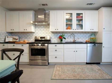 Sleek gold handles and white lacquer cabinets make this kitchen feel totally the homeowner outfits cooking space with white kitchen island cabinets and dark wooden floor. Some Ideas of the Popular yet Favourite Kitchen Backsplash ...