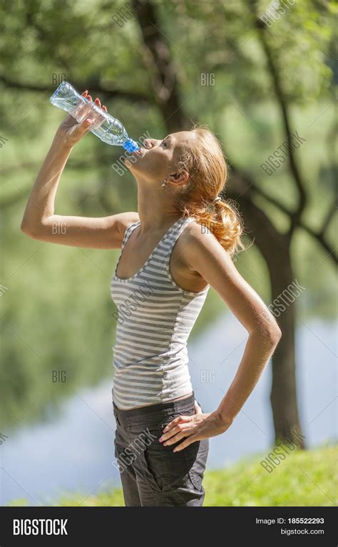 Young Woman Drinking Water Standing Image And Photo Bigstock