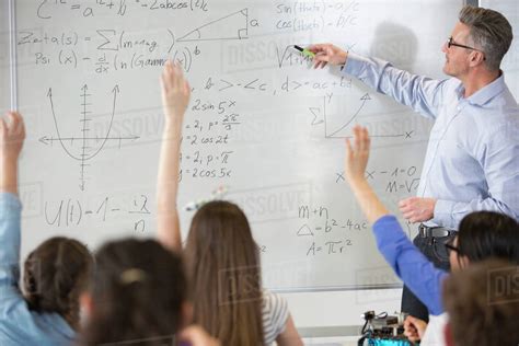 Come with tools like drawing, chat, etc. Male teacher leading physics lesson at whiteboard in ...