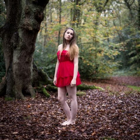 Portrait Of A Beautiful Teenage Girl Standing In A Forest Stock Photo By Heijo
