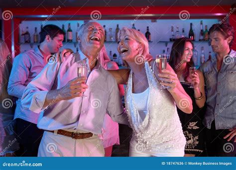 Senior Couple Having Fun In Busy Bar Royalty Free Stock Image Image