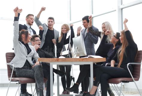 Happy Business Team Showing Their Success In The Workplace Stock Image