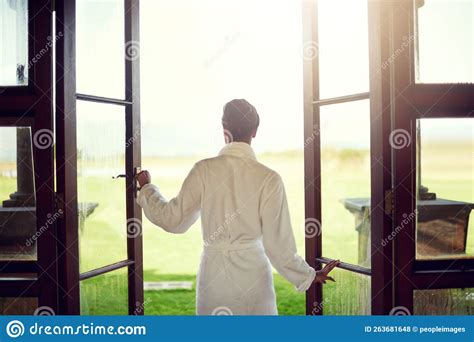 Open the Door To a Day of Pampering. Rearview Shot of a Young Woman