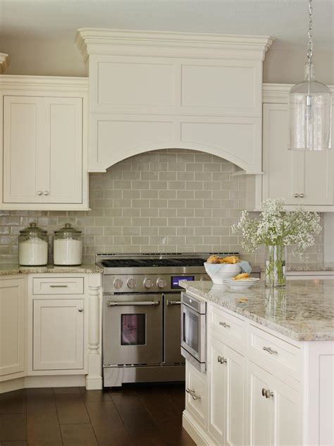 Granite for white kitchen cabinets. Kitchen With White Cabinets and Neutral Tile Backsplash | HGTV