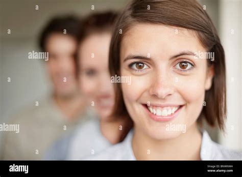 Three People Standing In A Row Stock Photo Alamy