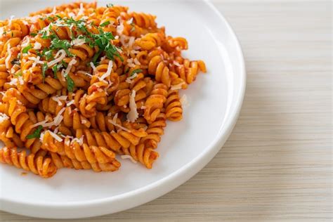 Premium Photo Spiral Or Spirali Pasta With Tomato Sauce And Cheese