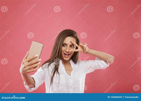 Close Up Portrait Of Young Beautiful Stylish Woman Making Selfie Using