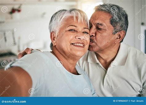 selfie portrait kiss and senior happy couple love home romance and bonding on memory photo