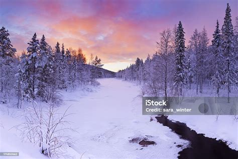 Sunrise Over A River In Winter Near Levi Finnish Lapland Stock Photo