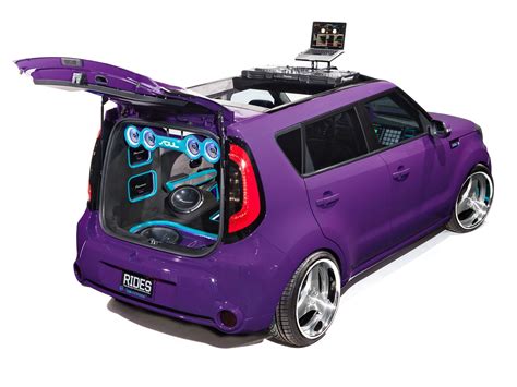 the back end of a purple car with its hatchback open and wheels in view