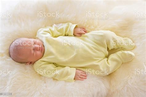 Newborn Baby Girl Sleeping On Fluff Stock Photo Download Image Now