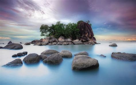 Low Angle Photography Of Island Surrounded With Islets On Body Of Water