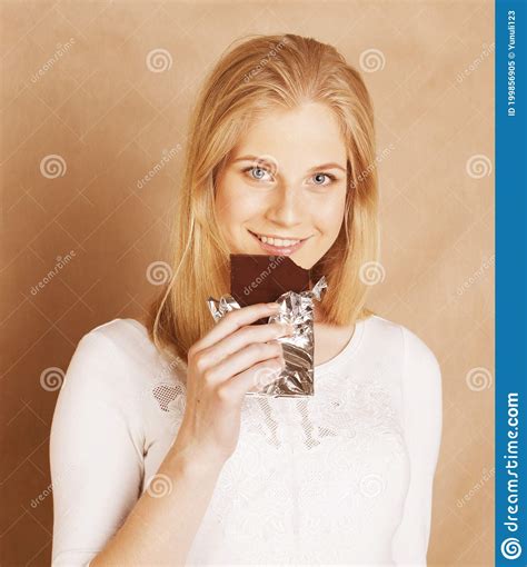 Young Beauty Blond Teenage Girl Eating Chocolate Smiling Stock Image Image Of Cream Candy