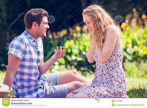 Handsome Man Doing Marriage Proposal To His Girlfriend Stock Image