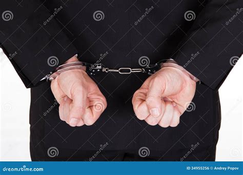 arrested businessman in handcuffs with hands behind back stock image 83787667