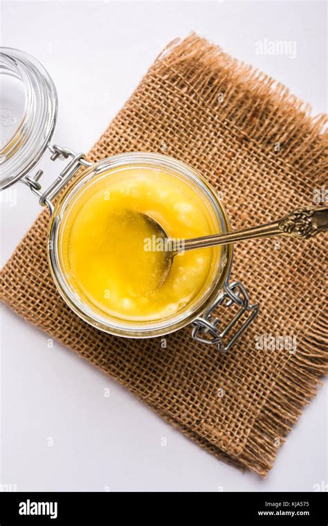 Desi Ghee Or Clarified Butter In Glass Or Copper Container Or Ceramic