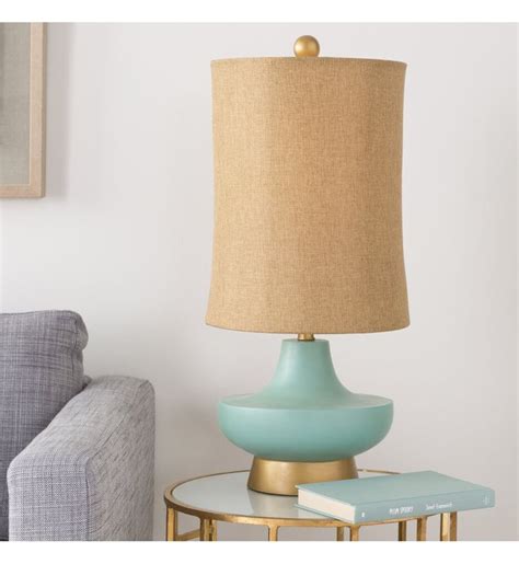 A Living Room Scene With Focus On The Table Lamp
