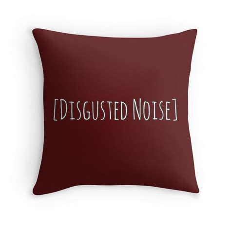 a red pillow with the words disgested noise printed on it in white letters