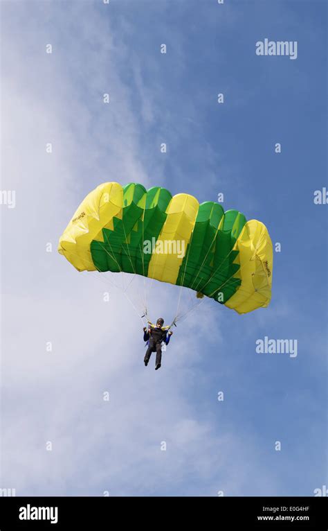 One Day With Parachutist In Airfield The Skydiver Landing Under Green