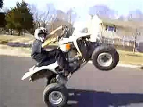 How to wheelie a quad (for class). z400 wheelie(4 wheeler) - YouTube