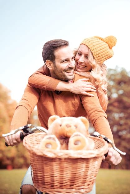 Premium Photo Happy Young Couple Riding Bicycle