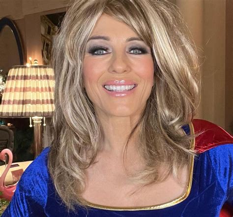 Elizabeth Hurley 56 Is A Sexy Supergirl In A Blond Wig
