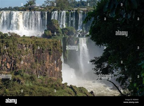 Iguazu Falls On The Border Of Argentina And Brazil On A Sunny Morning