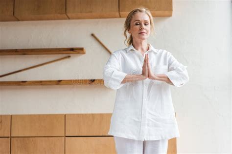 Sporty Mature Woman With Closed Eyes Showing Namaste Gesture While Stock Image Image Of Person