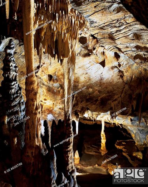 Stalacto Stalagmite Column In The Foreground With Stalactites And