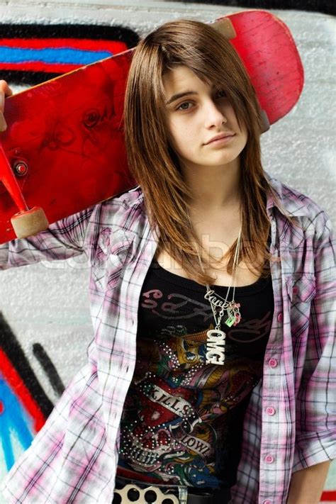 Pretty Skater Girl Holding Skateboard Stock Photo