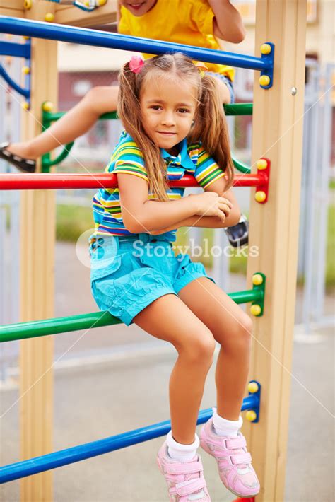 Happy Little Girl Looking At Camera On Playground Area Royalty Free