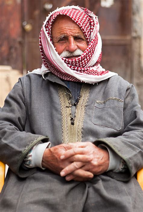 A Syrian Man Wearing A Kuffiyeh And Traditional Clothes On A Street In